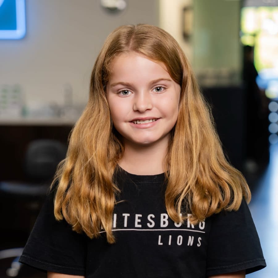 child patient smiling with braces